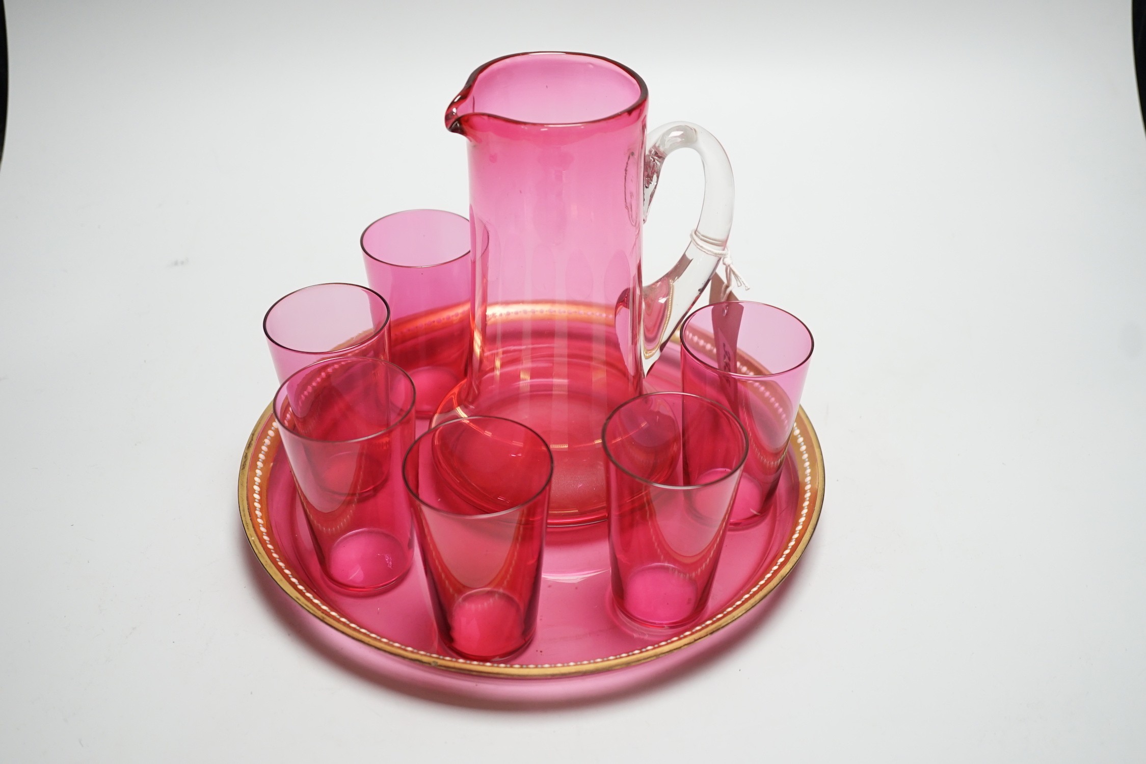 A cranberry glass lemonade six glass set, jug and tray